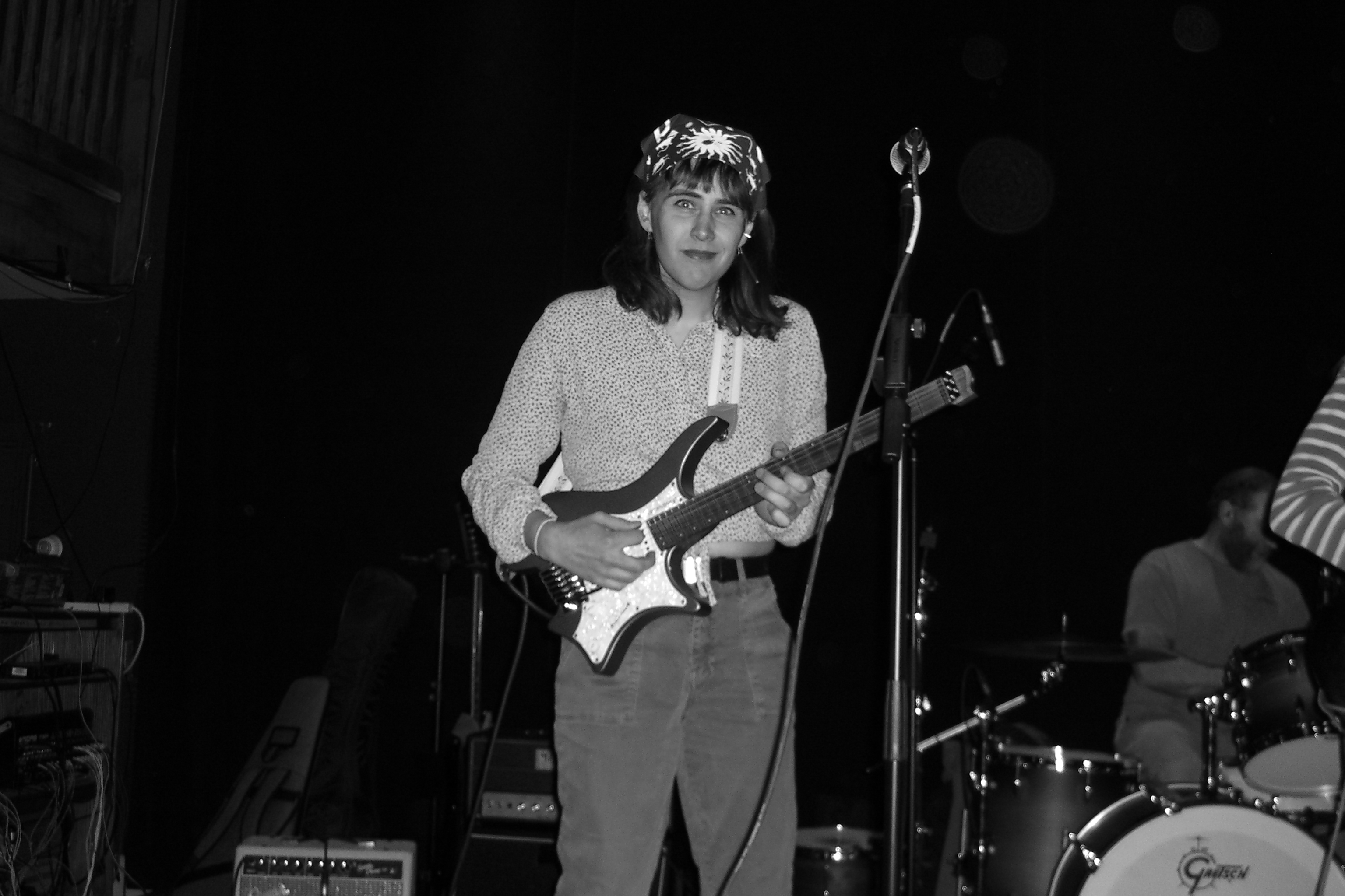 Person playing guitar on stage